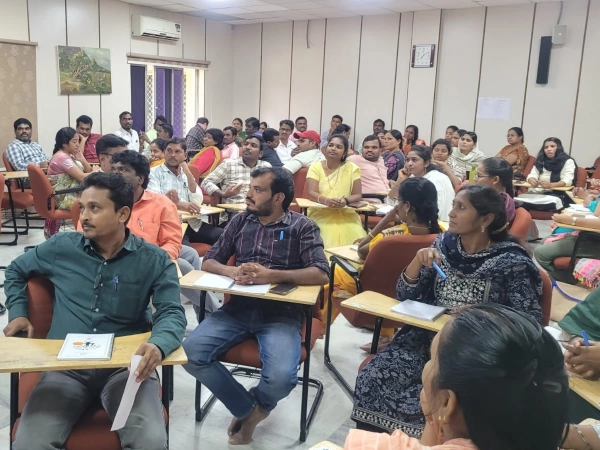  Teachers gathered in a room for an Outreach Training Programme.